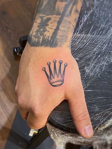 rolex tattoo hand|rolex logo tattoo designs.